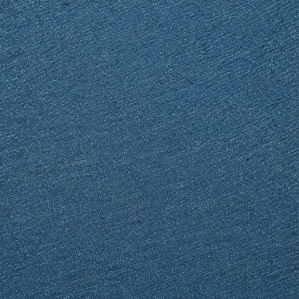 Blue denim fabric texture with visible weave and subtle fading