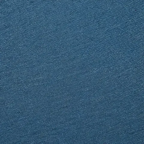Blue denim fabric texture with visible weave and subtle fading