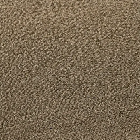 Close-up of beige linen fabric showing woven texture and natural fibers.