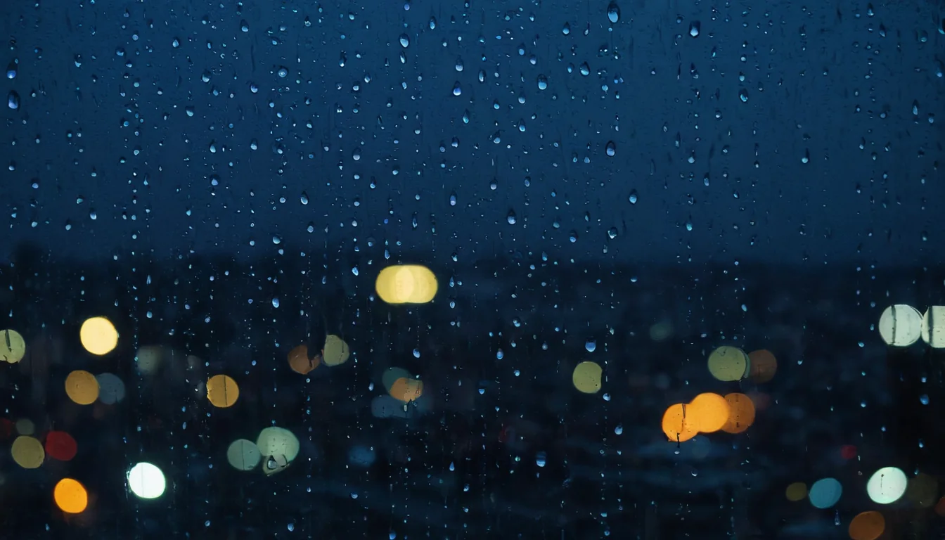 Raindrops on glass with blurred city lights glowing in the dark